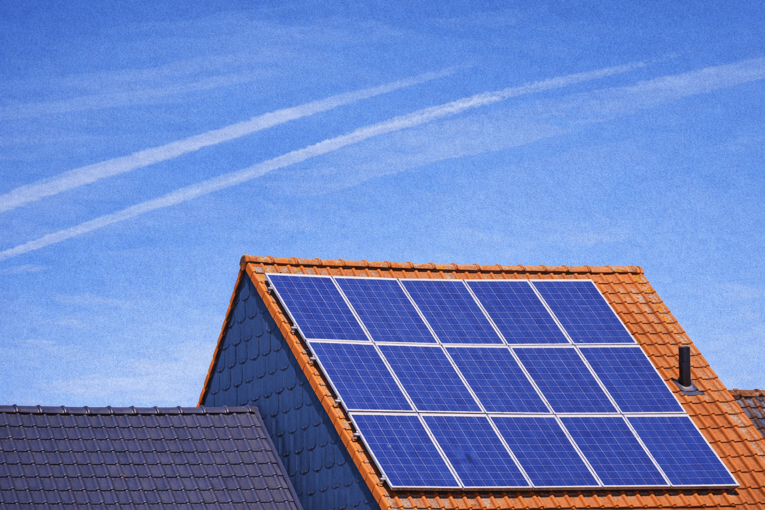 Solar panels under a bright sky